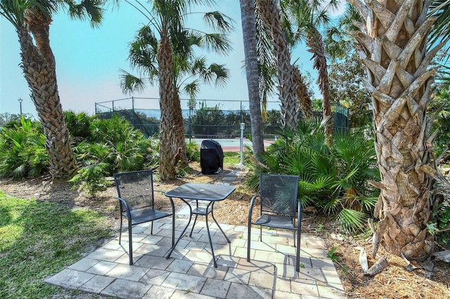 view of patio / terrace featuring fence