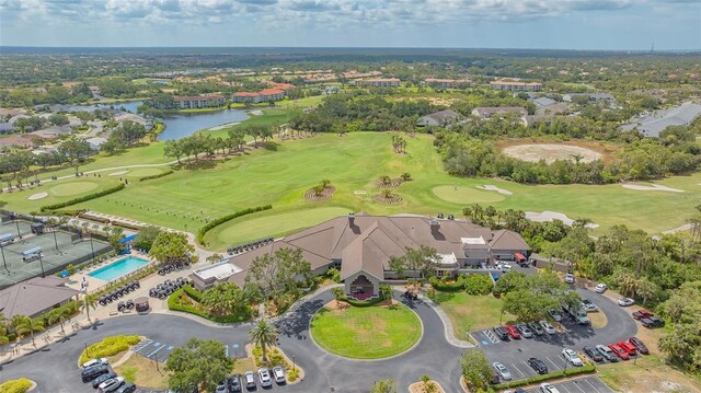 drone / aerial view of a large body of water and a golf club