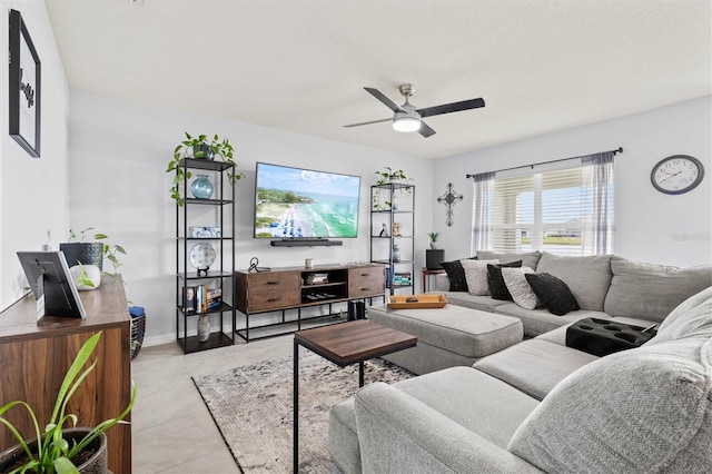 living room featuring ceiling fan and light tile patterned flooring