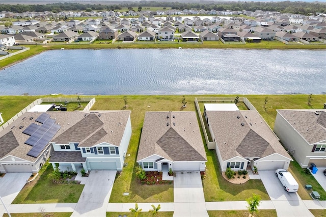 aerial perspective of suburban area with a large body of water