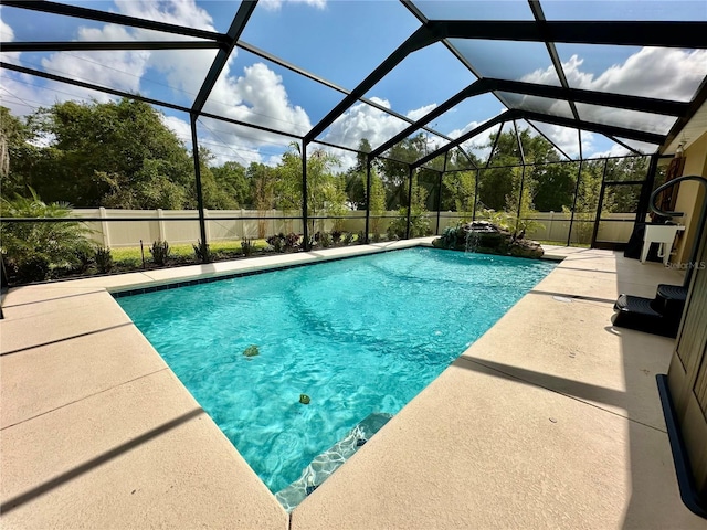 1568 Cordgrass Way, Lakeland, FL 33813 - outdoor pool featuring a patio area and glass enclosure