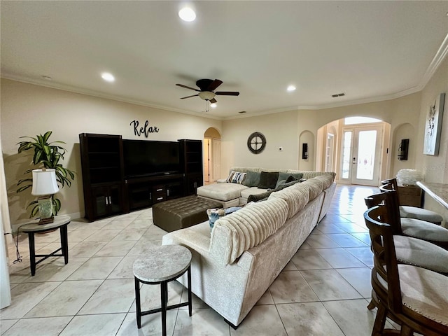 1568 Cordgrass Way, Lakeland, FL 33813 - living area with arched walkways, light tile patterned floors, recessed lighting, a ceiling fan, and crown molding