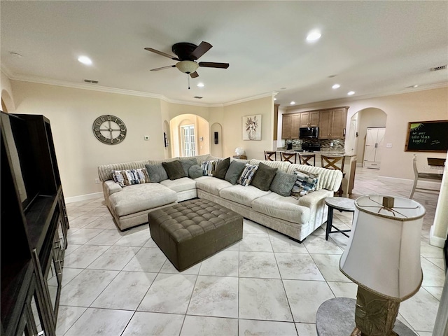 1568 Cordgrass Way, Lakeland, FL 33813 - living area featuring arched walkways, recessed lighting, a ceiling fan, crown molding, and light tile patterned floors