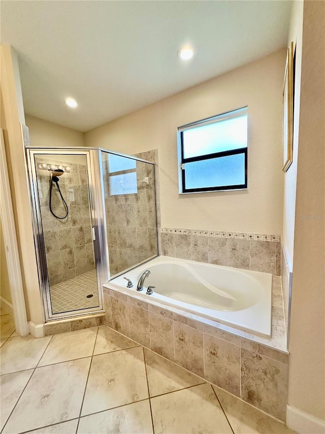 1568 Cordgrass Way, Lakeland, FL 33813 - bathroom featuring a bath, a stall shower, tile patterned flooring, and recessed lighting
