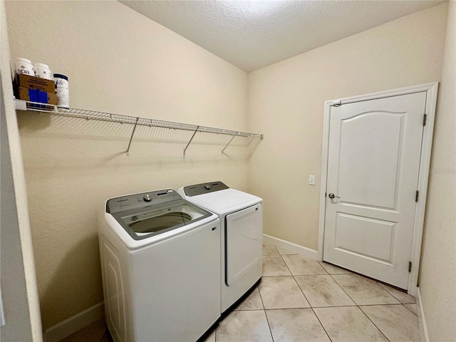 1568 Cordgrass Way, Lakeland, FL 33813 - washroom featuring independent washer and dryer and light tile patterned flooring