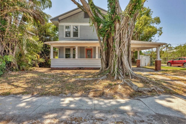 view of front facade featuring an attached carport and crawl space