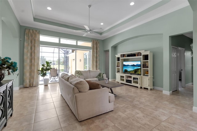 1542 Ormond Ter, Parrish, FL 34219 - living area featuring a ceiling fan, a tray ceiling, recessed lighting, baseboards, and crown molding
