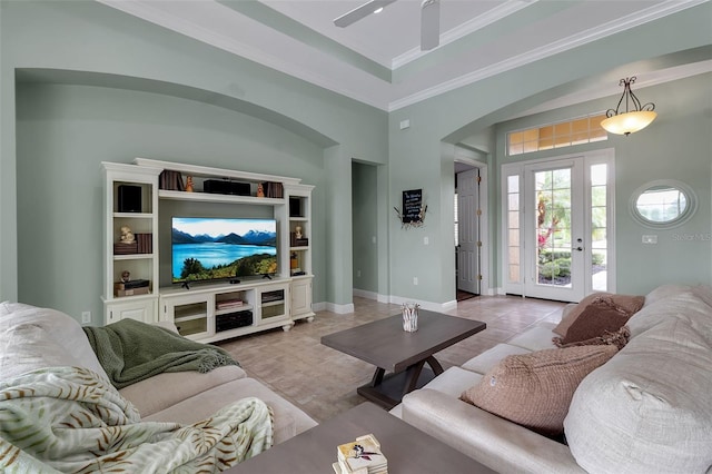 1542 Ormond Ter, Parrish, FL 34219 - tiled living room with arched walkways, ceiling fan, crown molding, and baseboards