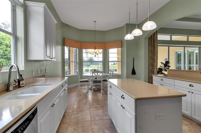 1542 Ormond Ter, Parrish, FL 34219 - kitchen featuring a sink, dishwasher, a kitchen island, and light tile patterned flooring