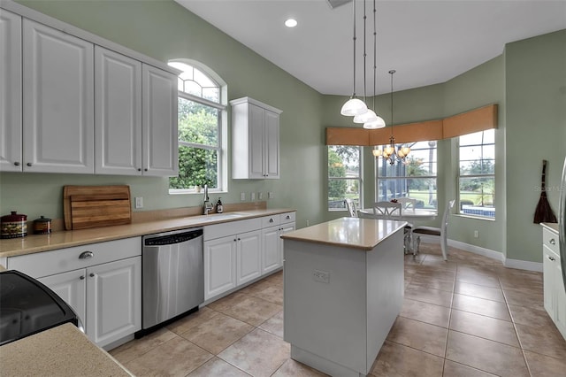 1542 Ormond Ter, Parrish, FL 34219 - kitchen with dishwasher, a sink, a kitchen island, a chandelier, and white cabinets