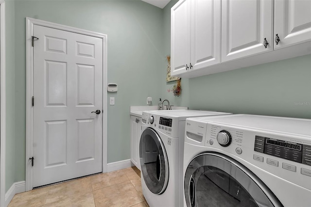 1542 Ormond Ter, Parrish, FL 34219 - washroom featuring cabinet space, washer and dryer, baseboards, and light tile patterned floors