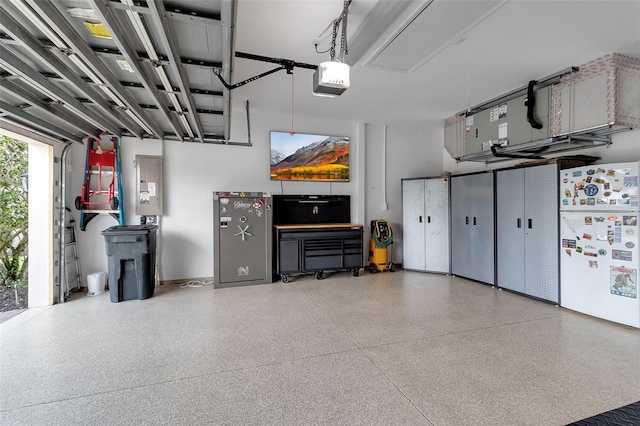 1542 Ormond Ter, Parrish, FL 34219 - garage with freestanding refrigerator, electric panel, and a garage door opener