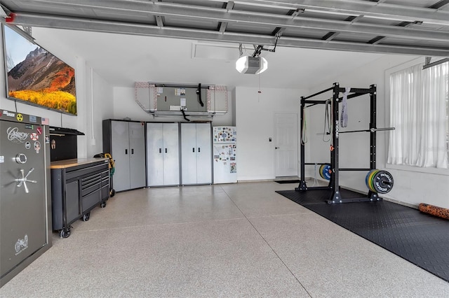 1542 Ormond Ter, Parrish, FL 34219 - garage with freestanding refrigerator and a garage door opener