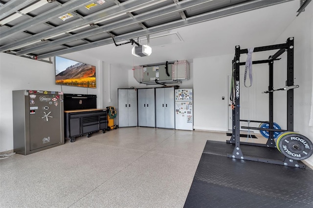1542 Ormond Ter, Parrish, FL 34219 - garage with a garage door opener and freestanding refrigerator