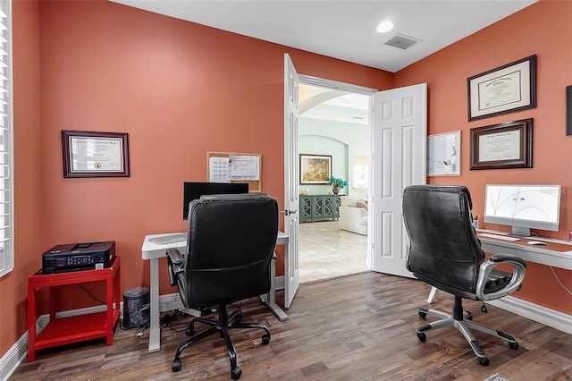 1542 Ormond Ter, Parrish, FL 34219 - office space with wood finished floors, arched walkways, and baseboards