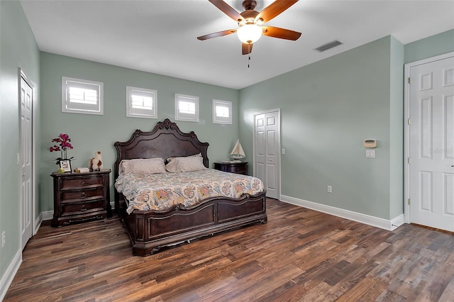 1542 Ormond Ter, Parrish, FL 34219 - bedroom with dark wood-type flooring, baseboards, and a ceiling fan