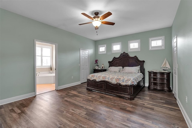 1542 Ormond Ter, Parrish, FL 34219 - bedroom with multiple windows, dark wood-style flooring, and baseboards