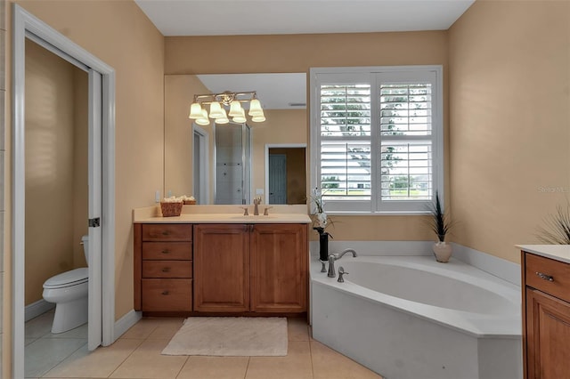 1542 Ormond Ter, Parrish, FL 34219 - full bathroom featuring vanity, a garden tub, a chandelier, toilet, and tile patterned flooring