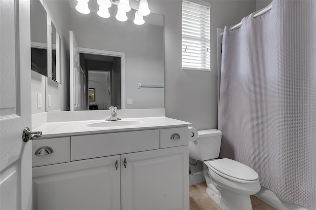1542 Ormond Ter, Parrish, FL 34219 - bathroom with toilet, vanity, and tile patterned floors