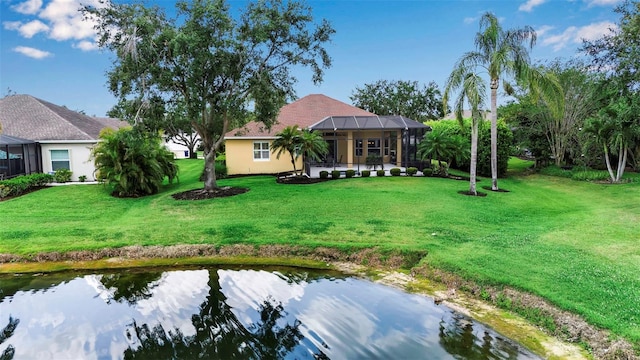 1542 Ormond Ter, Parrish, FL 34219 - back of house with a yard, a lanai, and stucco siding
