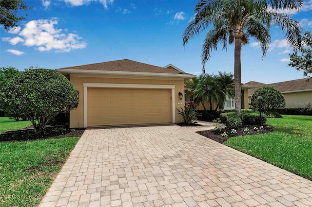 1542 Ormond Ter, Parrish, FL 34219 - ranch-style house with stucco siding, decorative driveway, a front lawn, and a garage