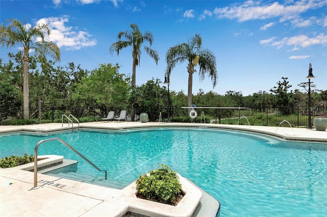 1542 Ormond Ter, Parrish, FL 34219 - community pool featuring fence and view of scattered trees