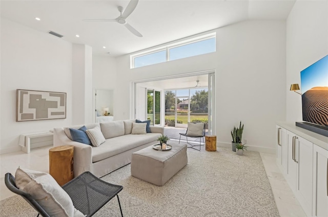living area featuring high vaulted ceiling, ceiling fan, baseboards, and recessed lighting