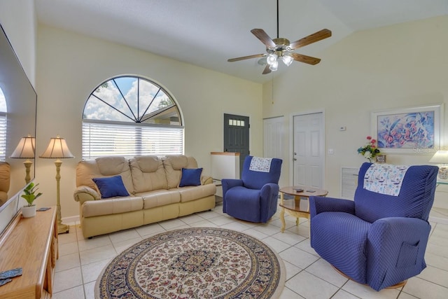living area featuring light tile patterned floors, high vaulted ceiling, and a ceiling fan