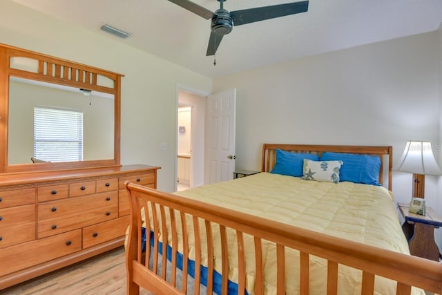bedroom with light wood-style flooring and ceiling fan