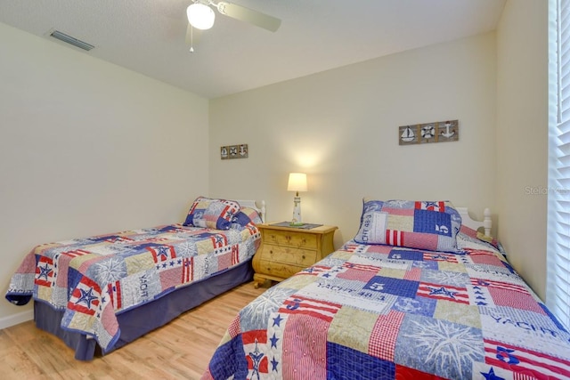 bedroom with wood finished floors and ceiling fan