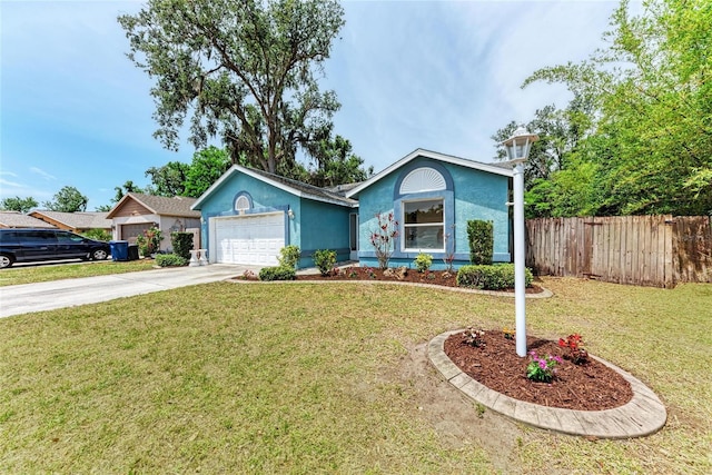 single story home with stucco siding, a garage, and driveway