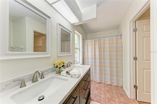 full bath with double vanity, tile patterned floors, and a shower with curtain