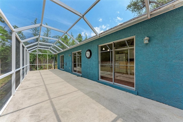 unfurnished sunroom featuring lofted ceiling