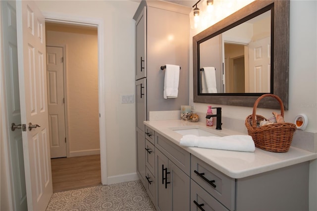bathroom with vanity and baseboards