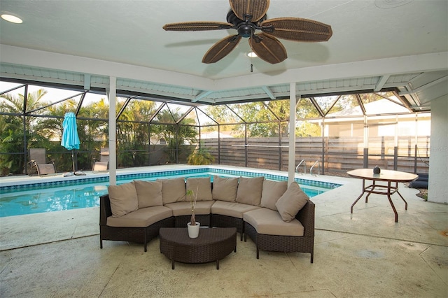 view of swimming pool featuring a fenced backyard, glass enclosure, and an outdoor living space