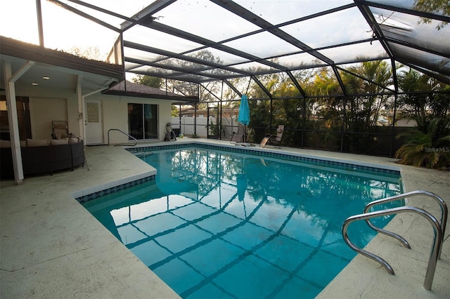 view of swimming pool with a patio, outdoor lounge area, and a lanai