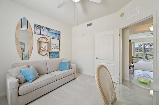 living room featuring ceiling fan and baseboards