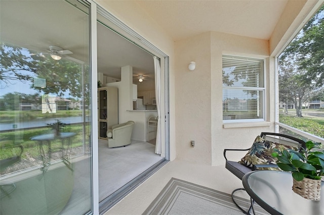 balcony featuring a water view