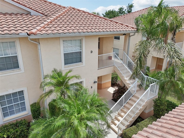 view of property featuring stairs