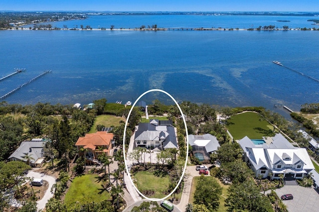 aerial perspective of suburban area with a nearby body of water
