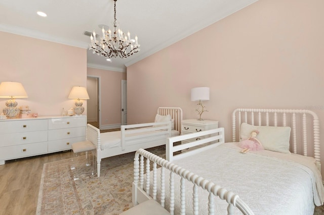 bedroom featuring ornamental molding, a chandelier, wood finished floors, and recessed lighting