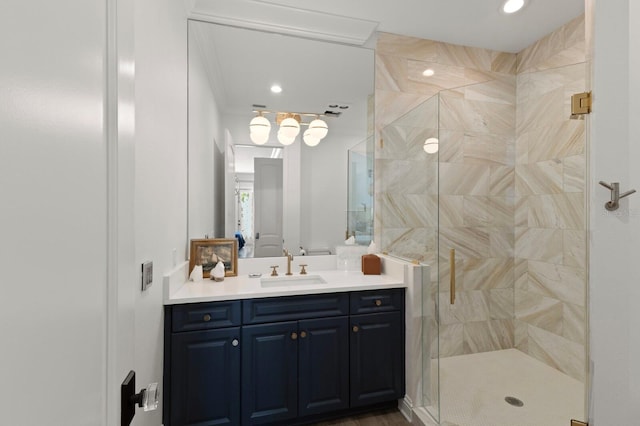 bathroom featuring a stall shower, vanity, and recessed lighting