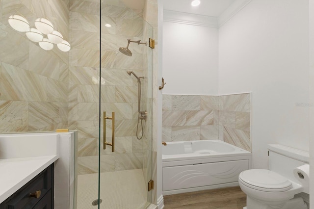 full bath with a garden tub, a shower stall, vanity, toilet, and wood finished floors