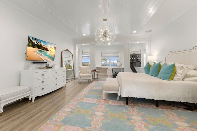 bedroom with ornate columns, light wood-style floors, a chandelier, ornamental molding, and recessed lighting