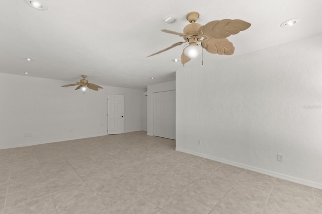unfurnished room with a ceiling fan, recessed lighting, and baseboards