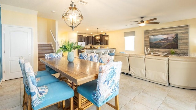 1450 Rolling Fairway Dr, Davenport, FL 33896 - dining space featuring stairway, ceiling fan, and light tile patterned flooring