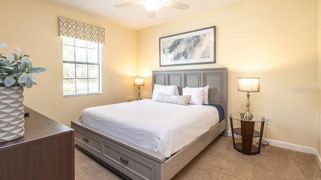 1450 Rolling Fairway Dr, Davenport, FL 33896 - bedroom with light colored carpet, ceiling fan, and baseboards