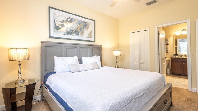 1450 Rolling Fairway Dr, Davenport, FL 33896 - bedroom featuring light carpet, a closet, ensuite bath, baseboards, and a ceiling fan