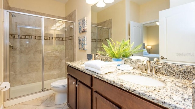 1450 Rolling Fairway Dr, Davenport, FL 33896 - bathroom with a shower stall, tile patterned flooring, double vanity, toilet, and ensuite bath
