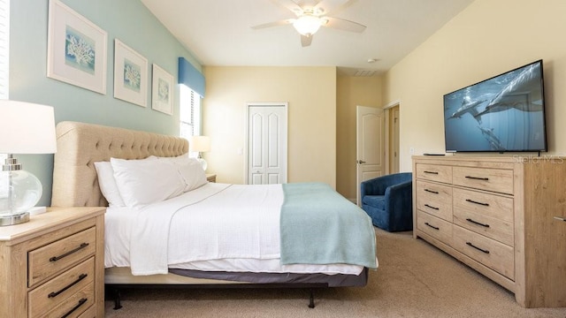 1450 Rolling Fairway Dr, Davenport, FL 33896 - bedroom with light colored carpet, a closet, and a ceiling fan